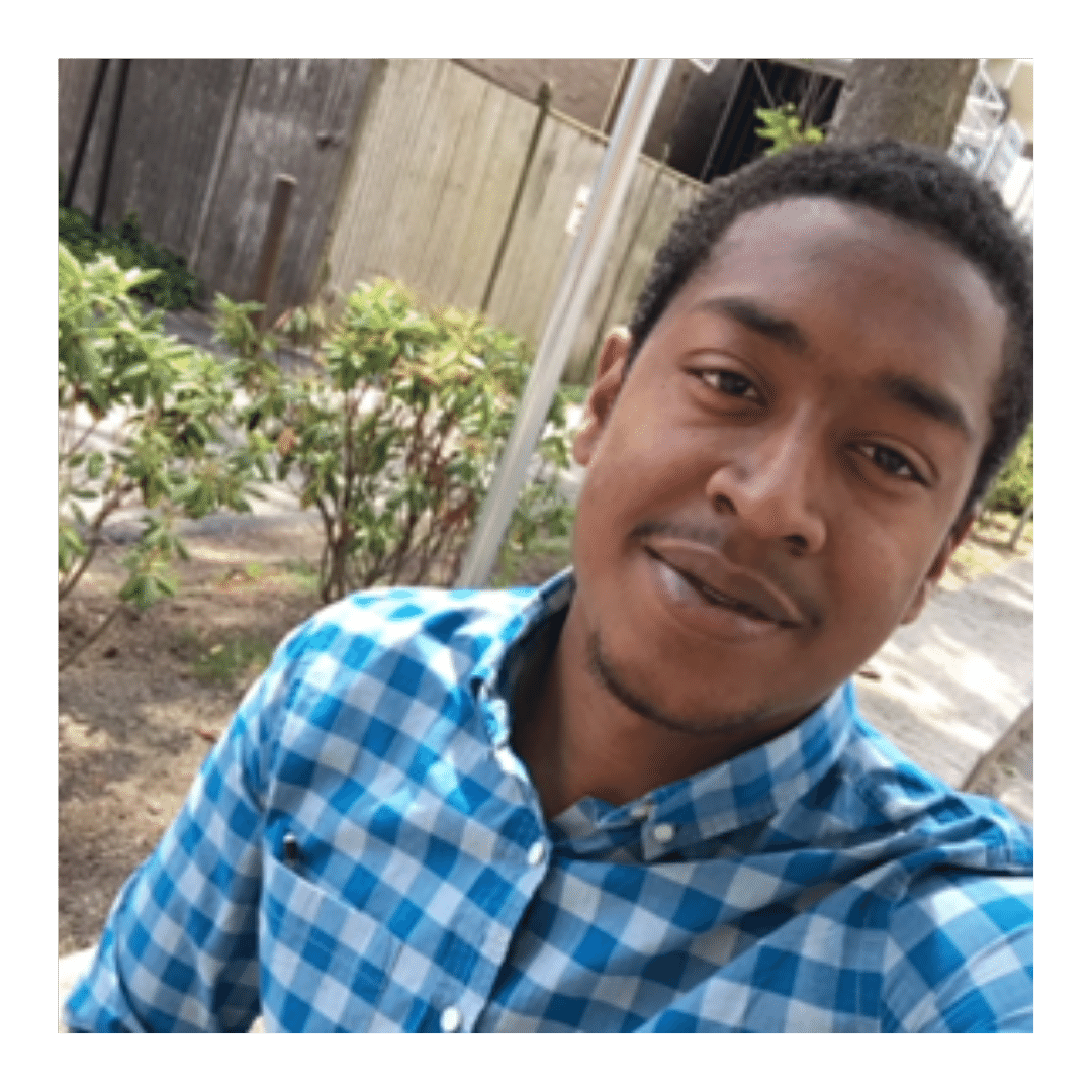 This is a photo of blogger Antwan Matthews outdoors smiling into the camera.